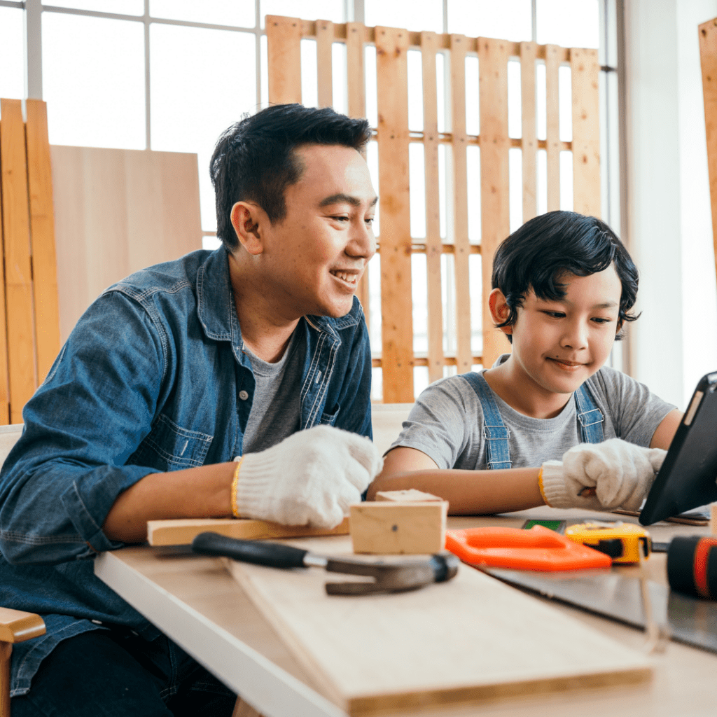 father and son doing diy projects in a workshop space